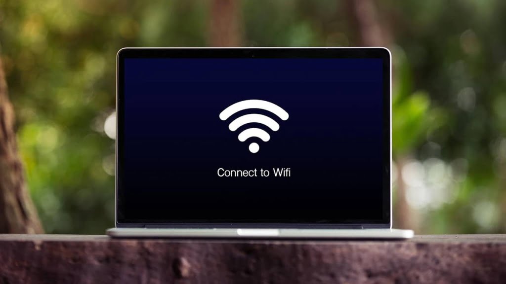 A laptop showing a WiFi connection on the screen.