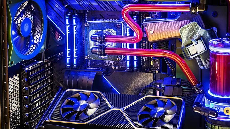 The inside of a gaming computer with custom liquid cooling built out inside it.