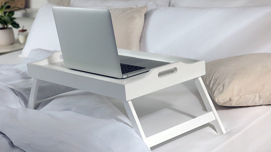 An example of a lapdesk used to reduce laptop heat in bed.