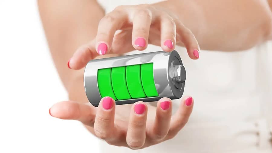 A pair of woman's hands is protecting a battery.