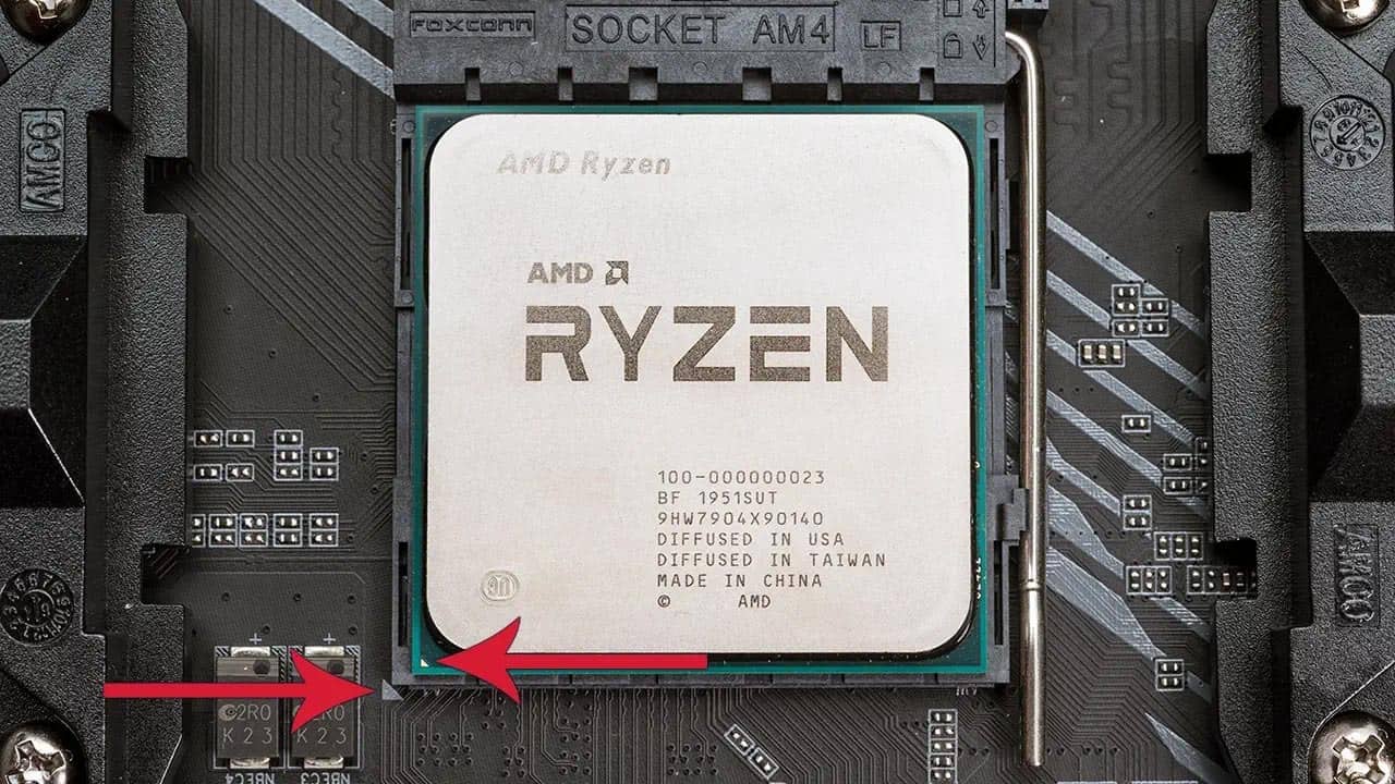 An AMD CPU correct alignment or orientation with pins and corresponding marking with arrows to illustrate.