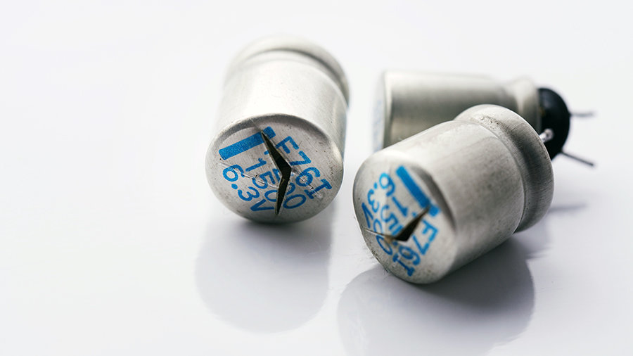 Swollen and leaky electrolytic capacitors.
