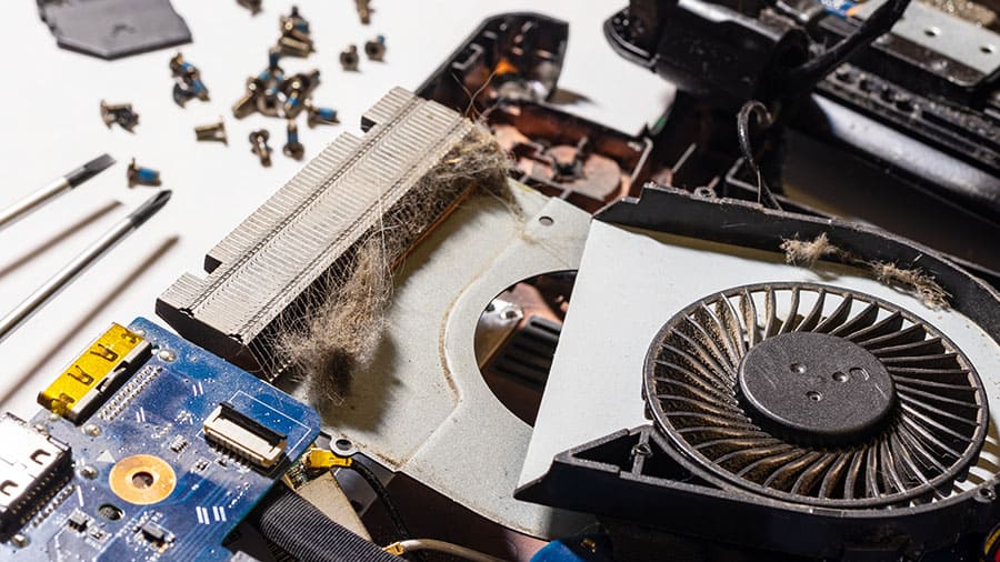 A dusty clogged laptop cooling system.