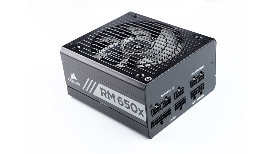 A computer power supply (PSU) which is rated at 650W.