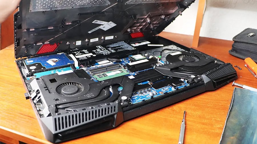 The inside of a gaming laptop with a cooling system clearly visible.