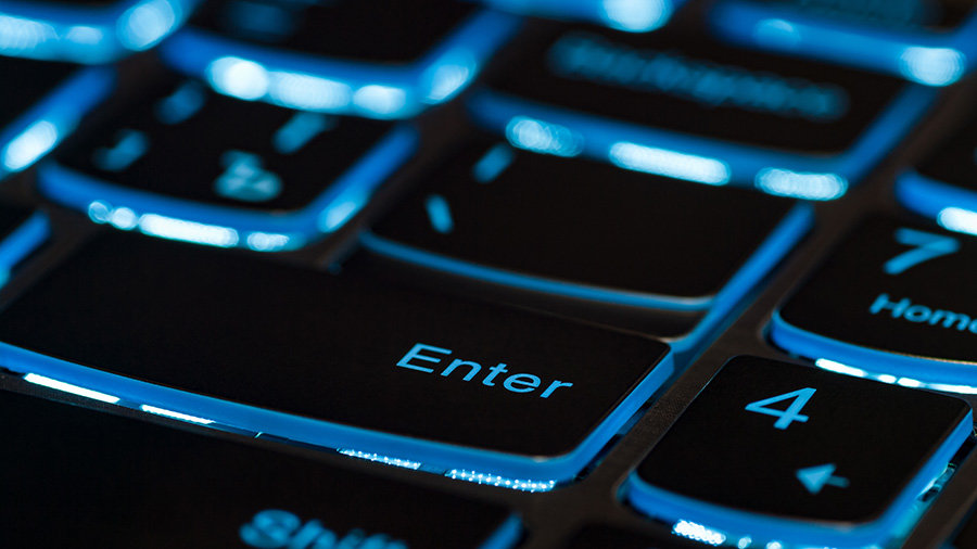 A laptop keyboard with backlit keys.