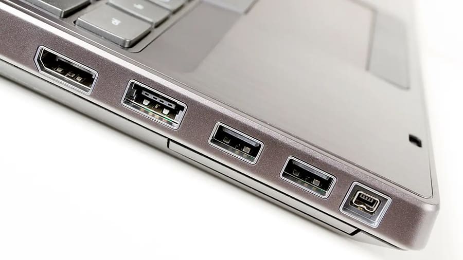 A laptop with many connection ports is available.