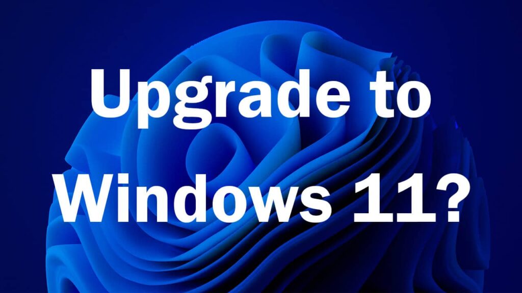 Text on a blue background asking whether or not to upgrade to Windows 11.