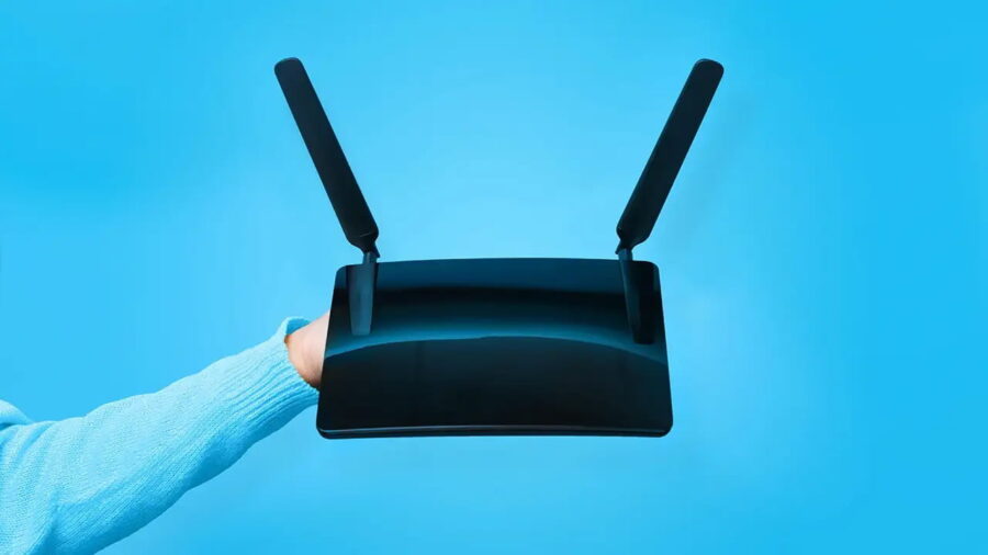 A WiFi router being held up.