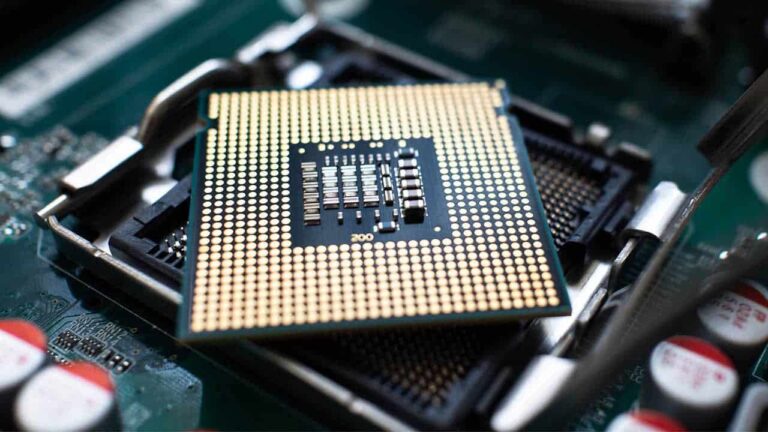 A CPU is placed on top of a socket.