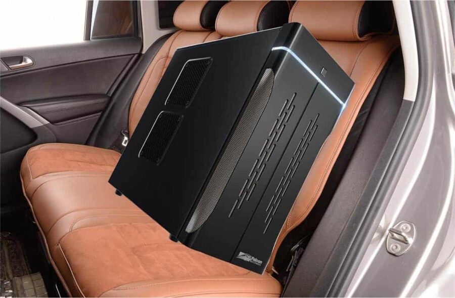 A desktop PC is placed in the back seat of a car.