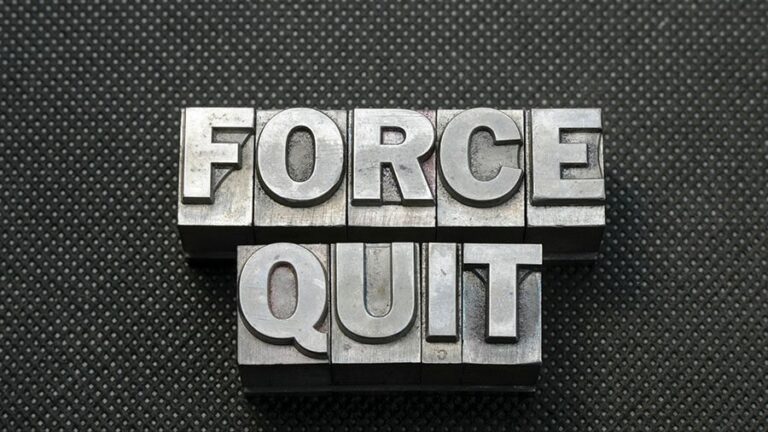 Metal stamps arranged to spell force quit.