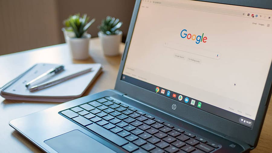 A Chromebook is placed on a table.