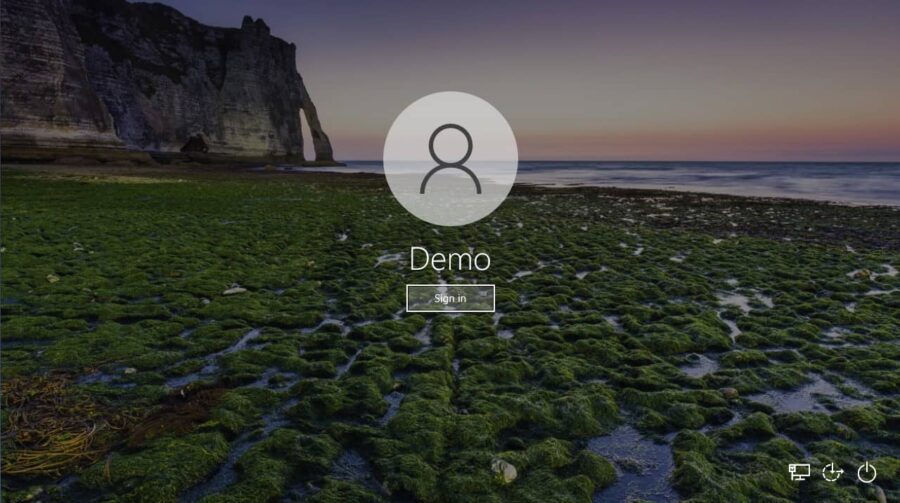 A Windows lock screen with login area.